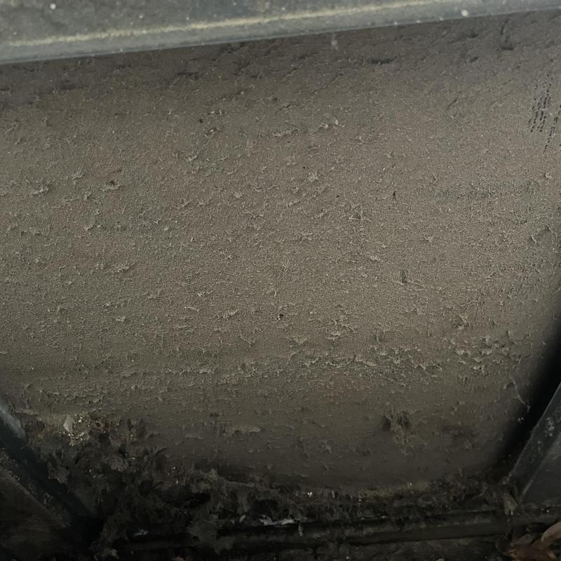 Condenser coil clogged with dirt and debris buildup