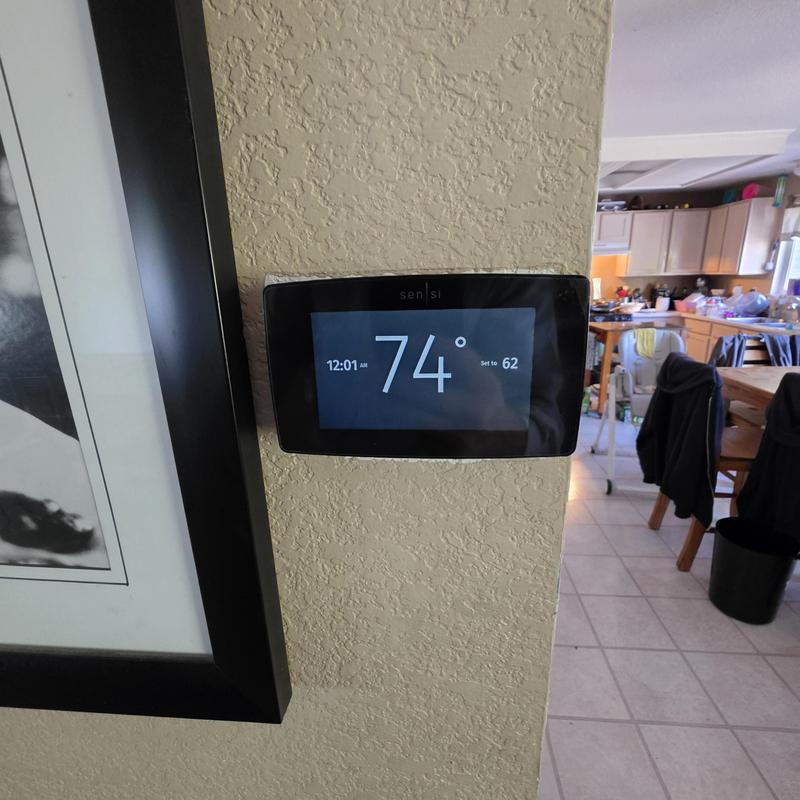 Sensi touchscreen thermostat display on wall