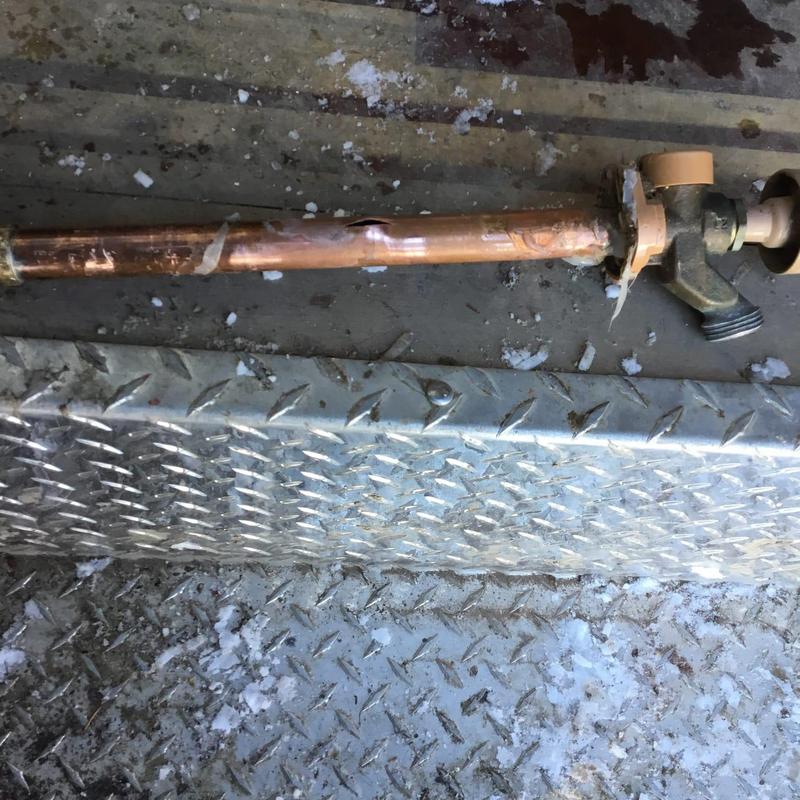 Copper pipe with frozen burst near hose bib valve