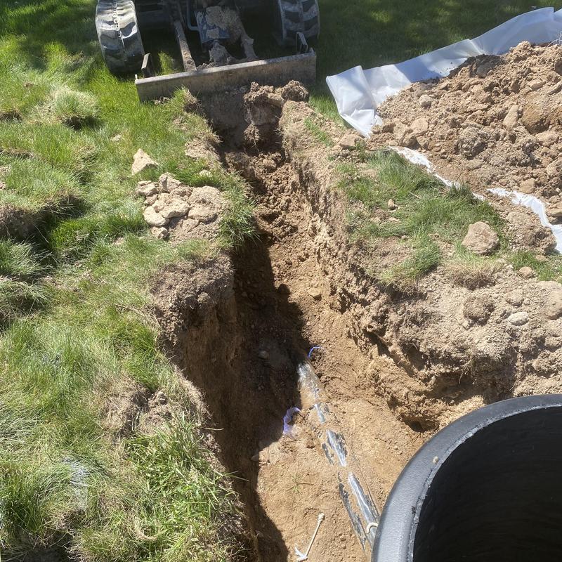 Septic tank inlet pipe replacement and trench excavation