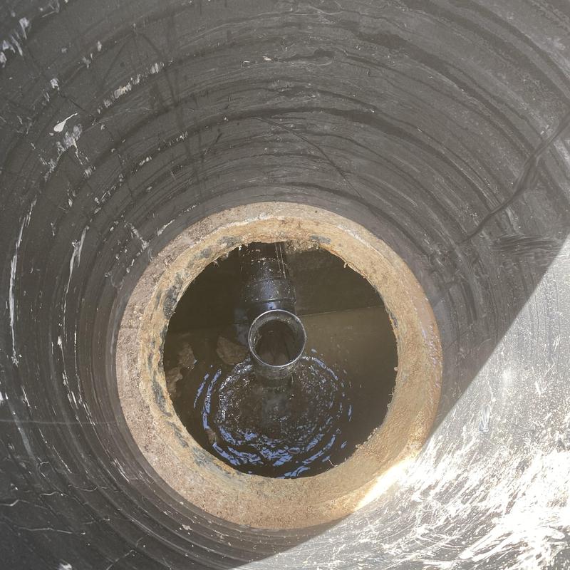 Septic tank inlet pipe with standing water inside
