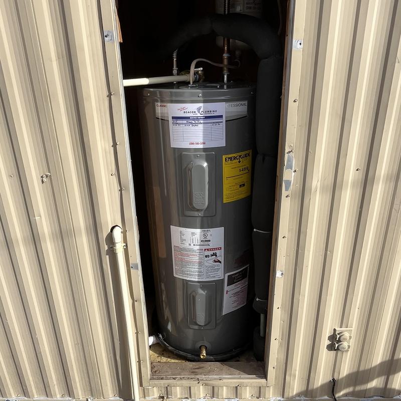 Electric water heater installation in metal enclosure