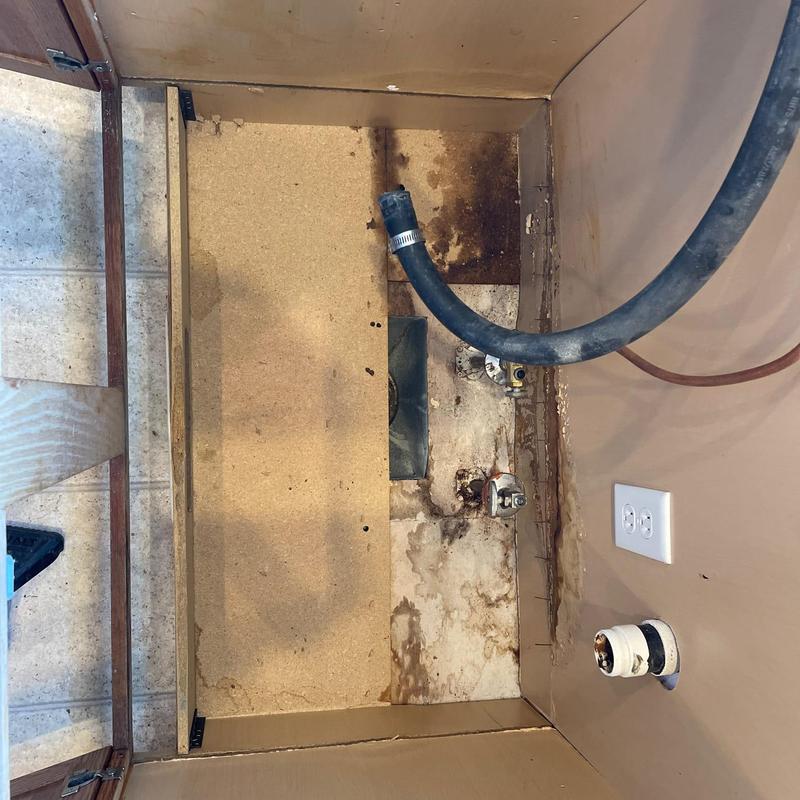 Kitchen sink area with plumbing removal and angle stops
