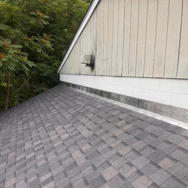 Asphalt shingle roof installation with new flashing detail