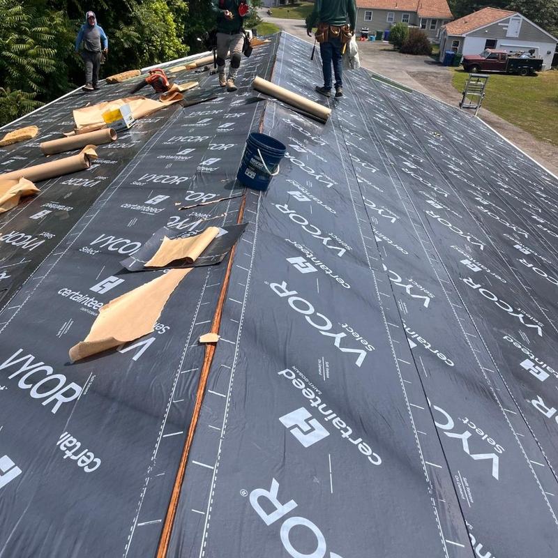 Roof underlayment installation on residential building