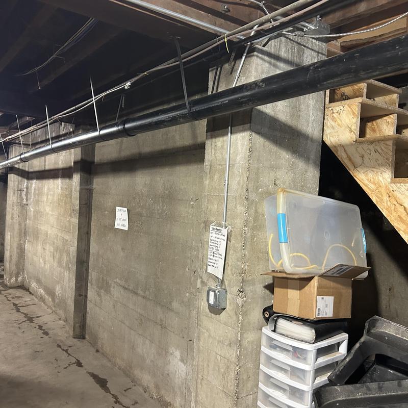 Plastic mainline drain pipe installation in basement