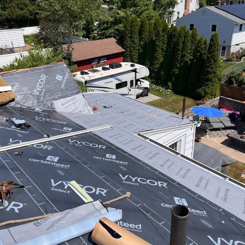Roof underlayment installation on residential home