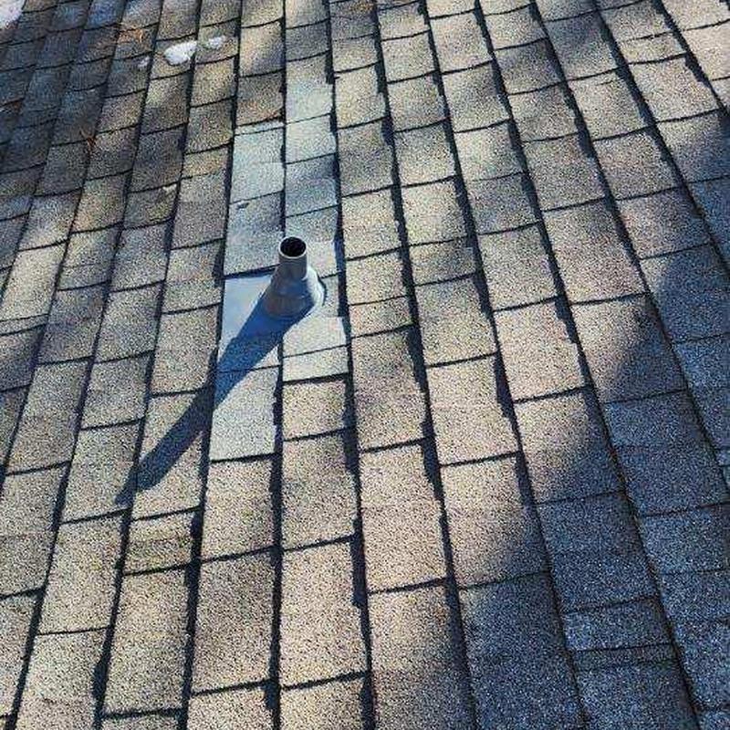 Asphalt shingle roof with vent pipe flashing repair