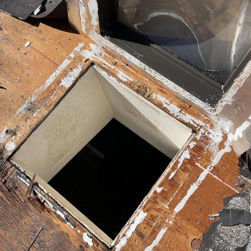 Skylight opening with removed old frame on roof