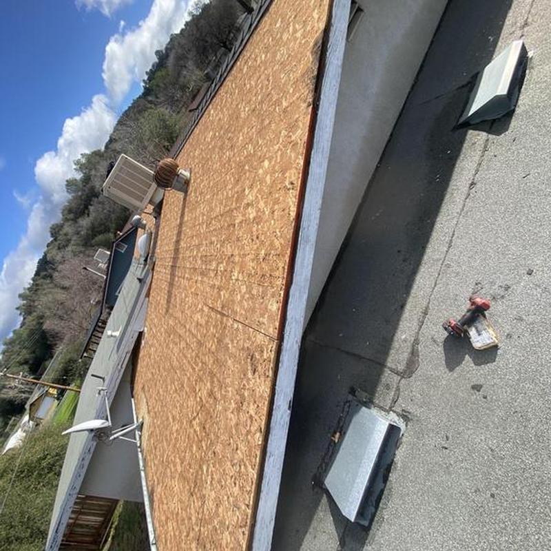 Roof sheathing panel installation on residential flat roof