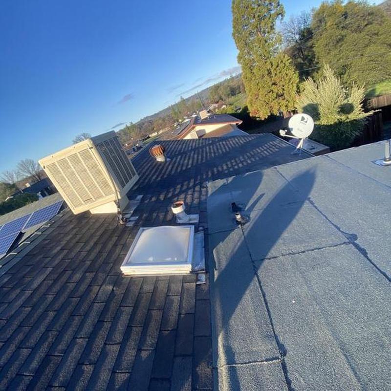 GAF shingle roof with skylight and HVAC unit