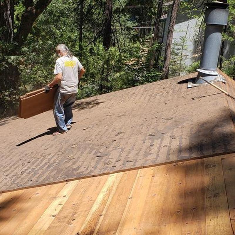Asphalt roof decking replacement on cabin roof