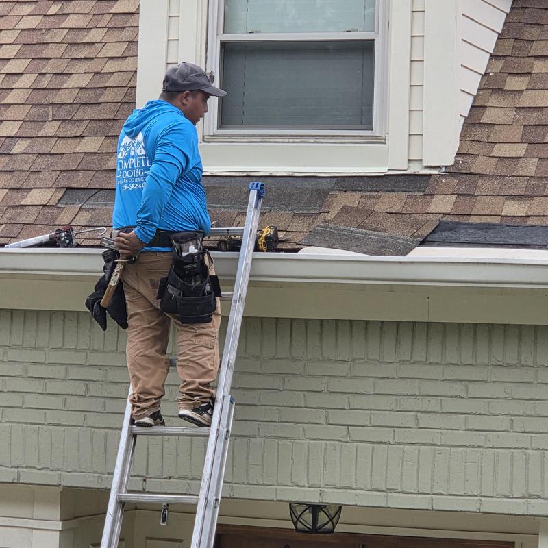 CertainTeed Resawn Shake roofing installation on ladder