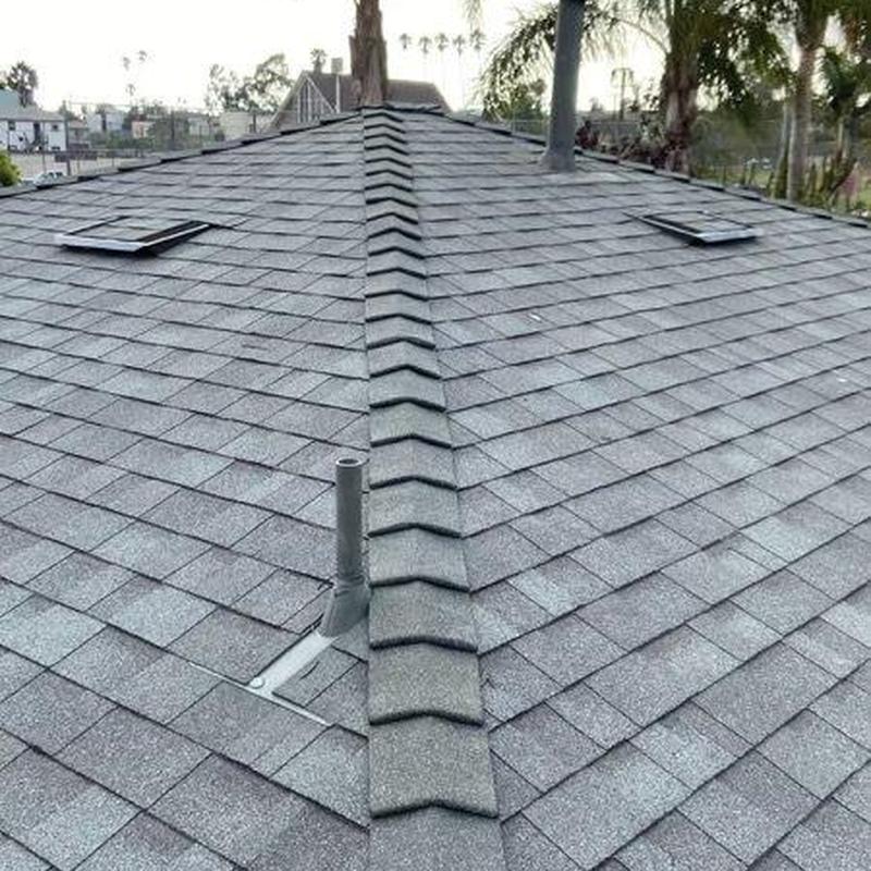 Shingle roof with ridge cap and vent pipes installation Shingle roof with ridge cap and vent pipes installation