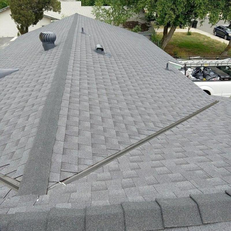 Asphalt shingle roof with ridge vent and flashing Asphalt shingle roof with ridge vent and flashing