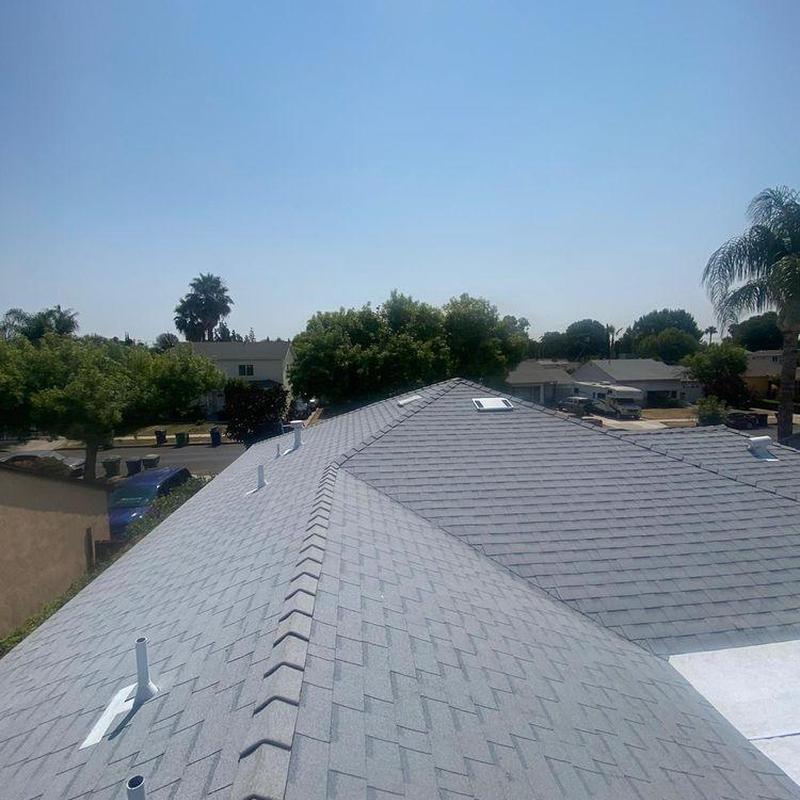 Shingle roof with ridge ventilation and skylight installation Shingle roof with ridge ventilation and skylight installation
