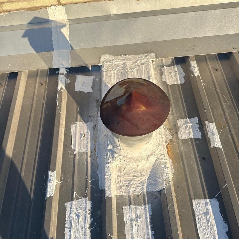 Metal roof vent with sealed flashing patches