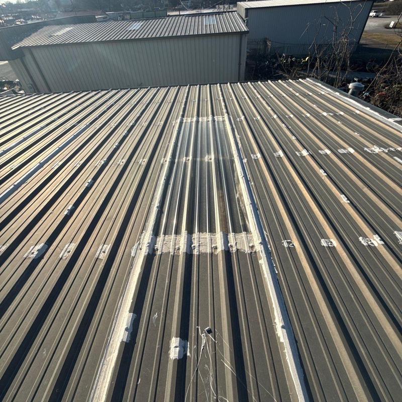 Metal commercial roof hail damage inspection and patching