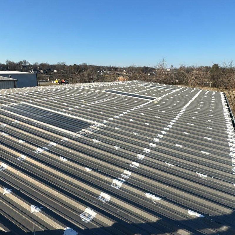 Metal roofing hail damage with sealed fasteners