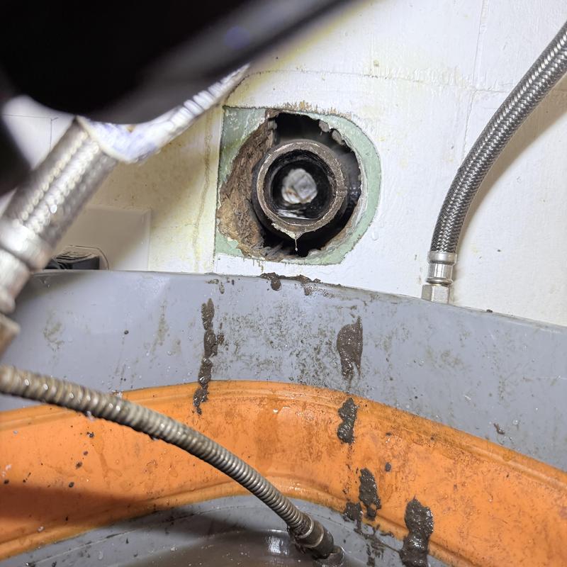 Lavatory drain pipe with buildup and repair work