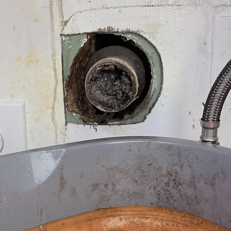 Lavatory drain pipe blockage with basin and supply line nearby