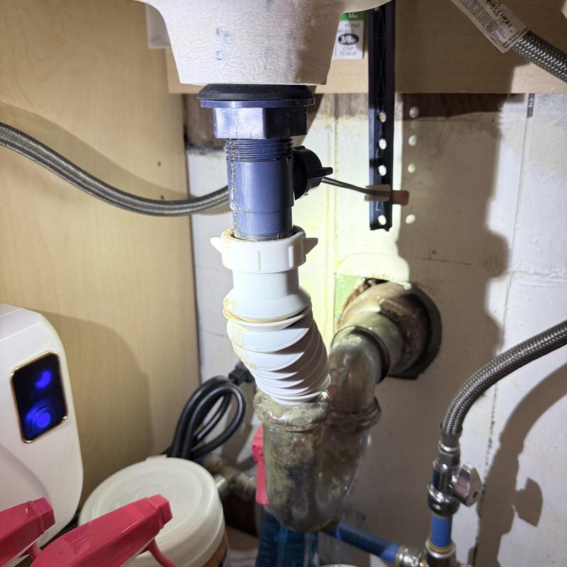 Lavatory drain pipe with flexible connector under sink
