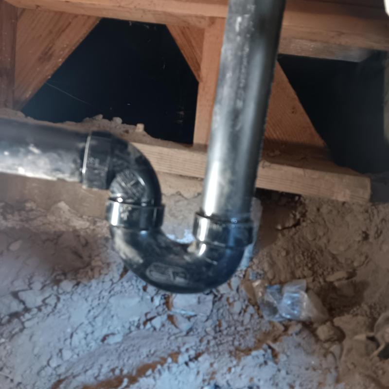 Bathtub waste trap pipe under home in Lancaster Ca