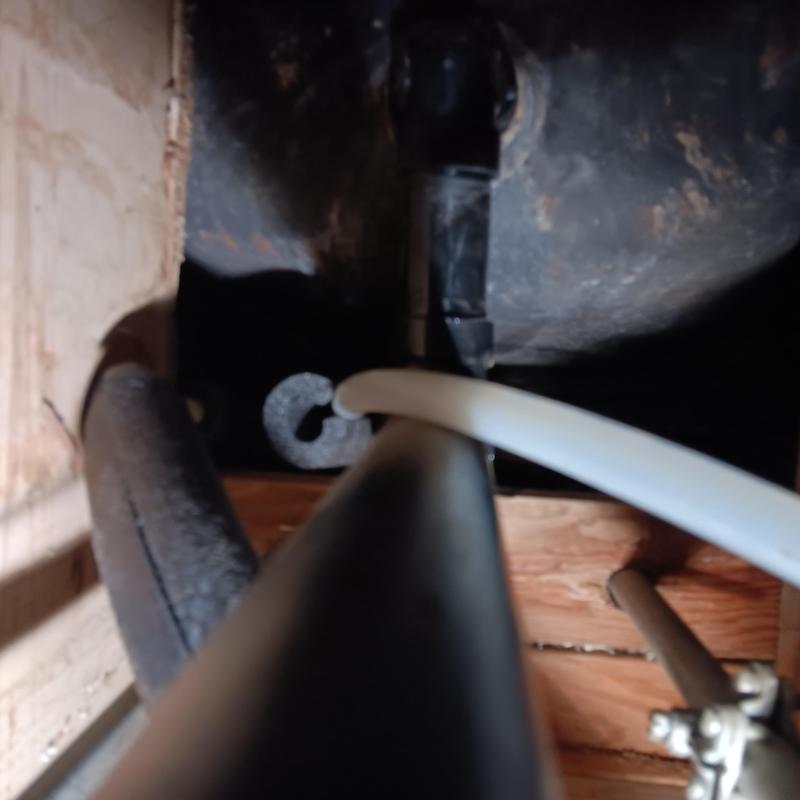 Bathtub waste and overflow drain line under home