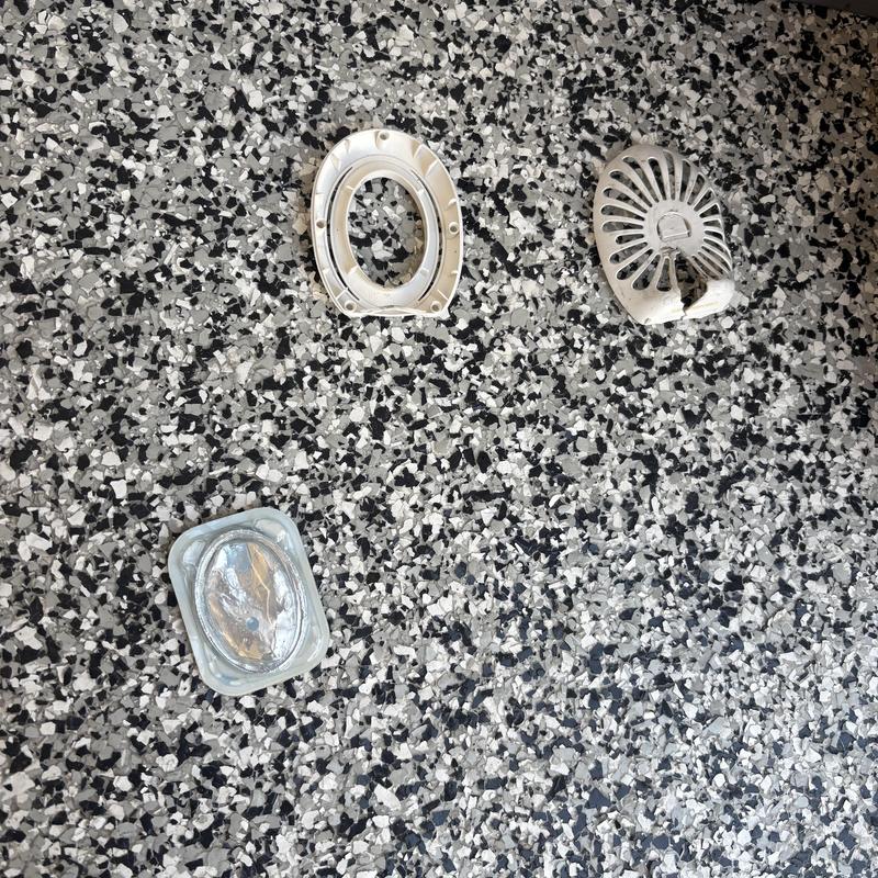 Toilet wax ring and mounting hardware on floor Toilet wax ring and mounting hardware on floor