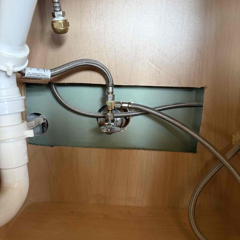 Under-sink shut off valve with braided hoses installed Under-sink shut off valve with braided hoses installed
