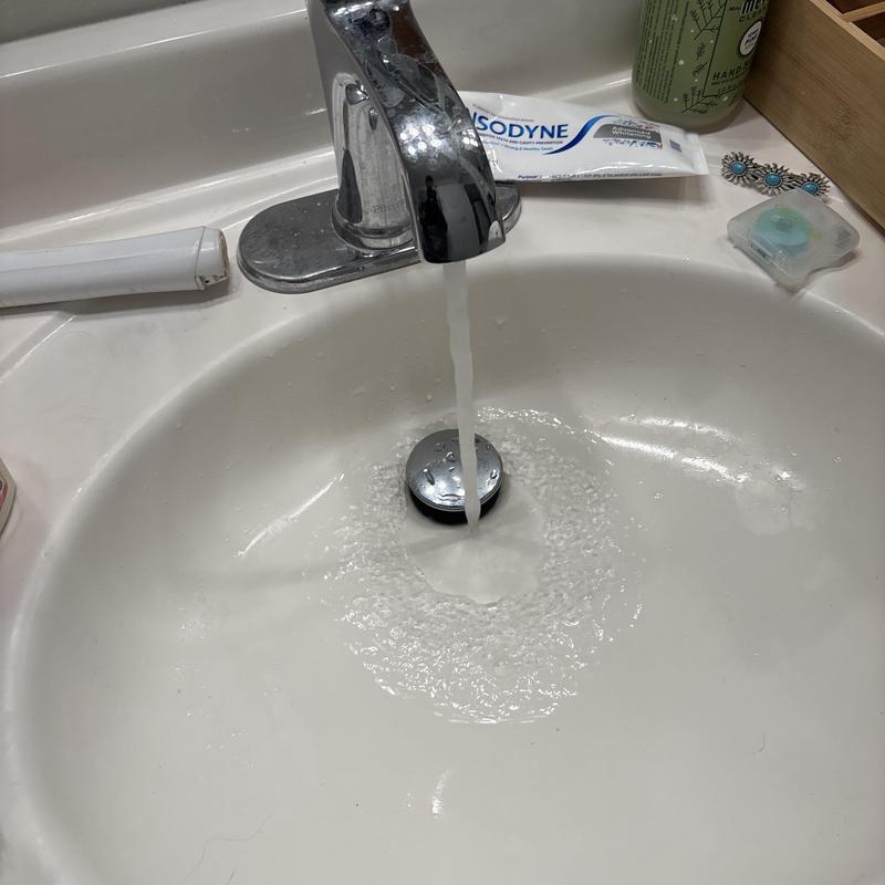 Bathroom sink faucet with running water flow