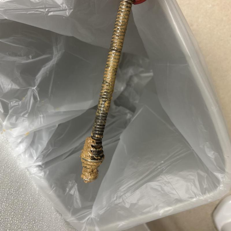 Toilet auger with debris from clog removal Toilet auger with debris from clog removal