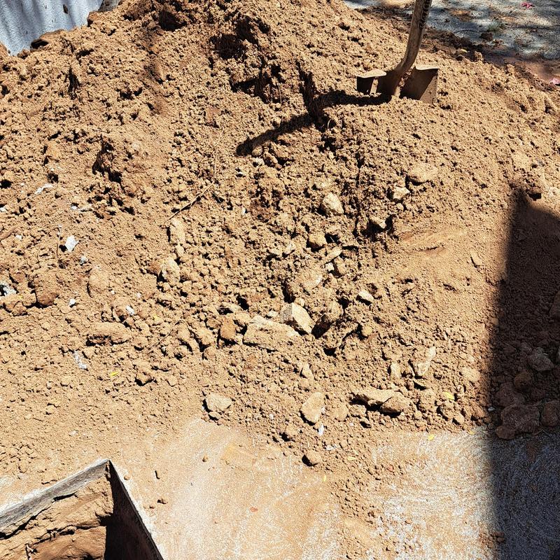 Sewer line excavation with soil pile and shovel Sewer line excavation with soil pile and shovel