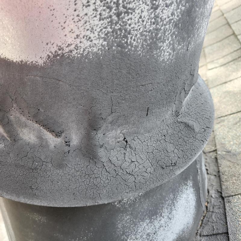Chimney flashing with cracked sealant and wear