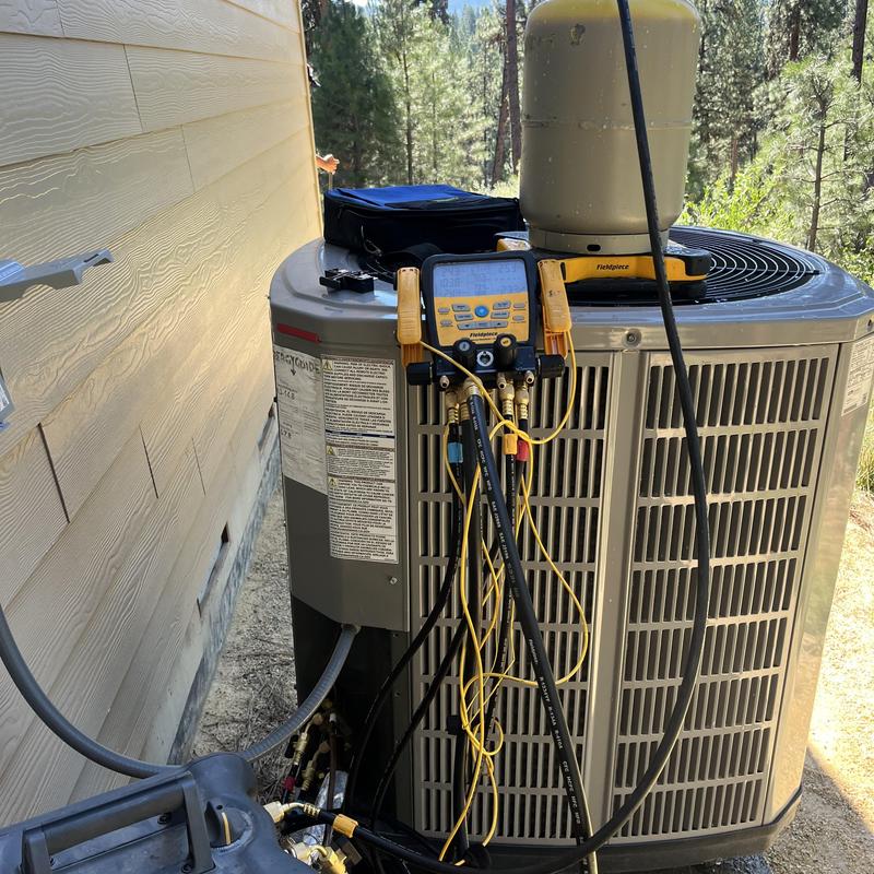 Air conditioner compressor with diagnostic gauges installed outdoors Air conditioner compressor with diagnostic gauges installed outdoors