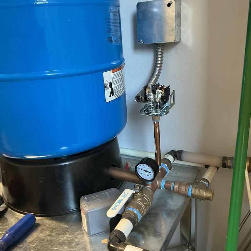 Well pressure tank with gauge and plumbing connections Well pressure tank with gauge and plumbing connections