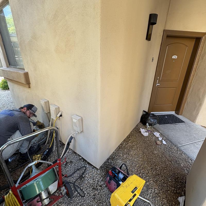 Water line leak near exterior wall and AC units