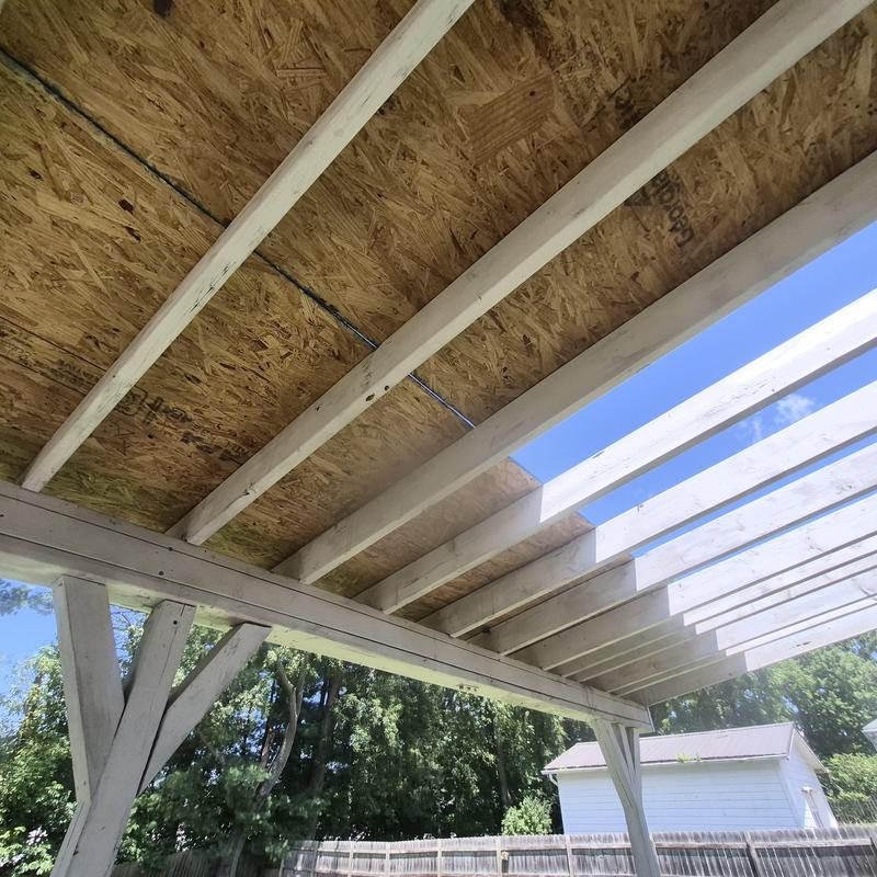 1x6 deck boards and OSB patio roof framing installation