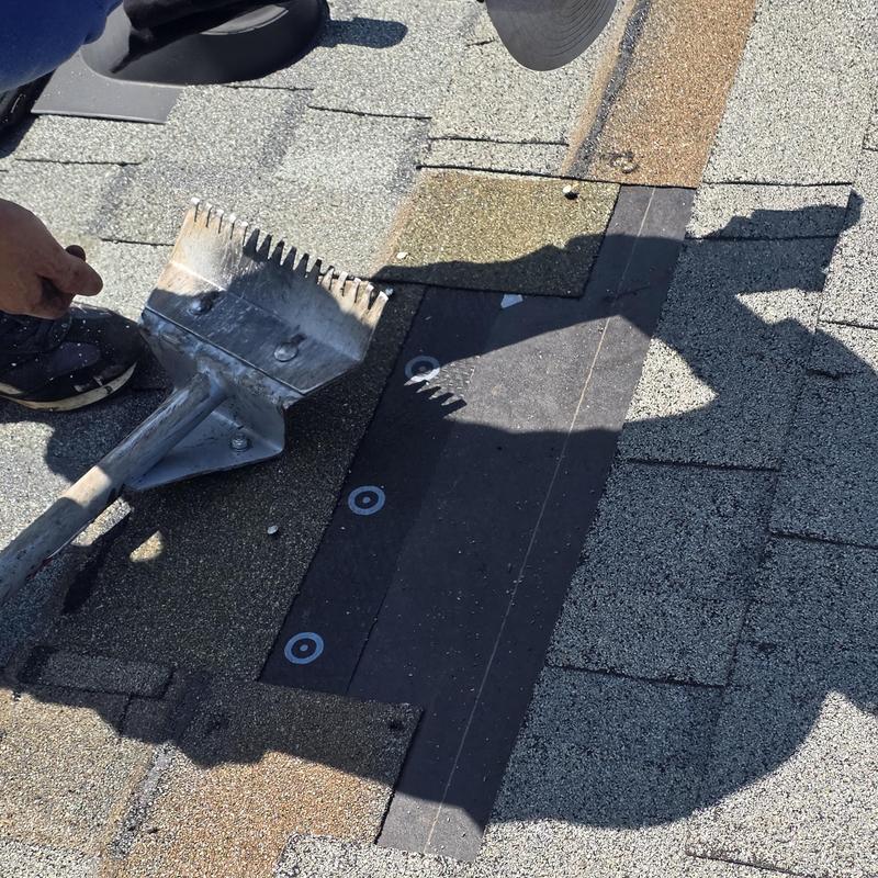 Asphalt shingle roof with nail pops sealed and vents removed