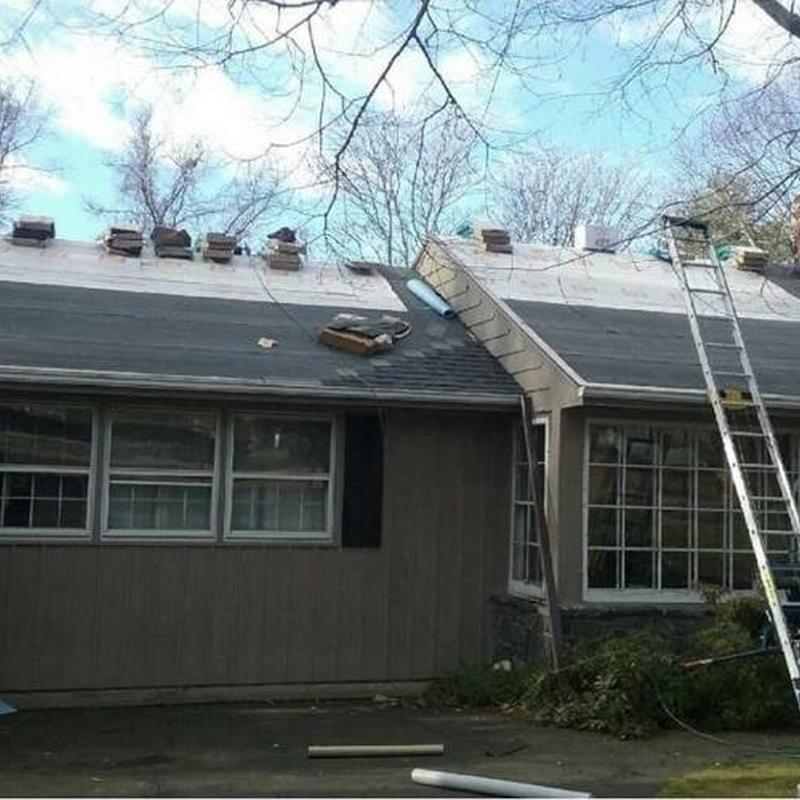 Asphalt shingle roof installation with ladder access