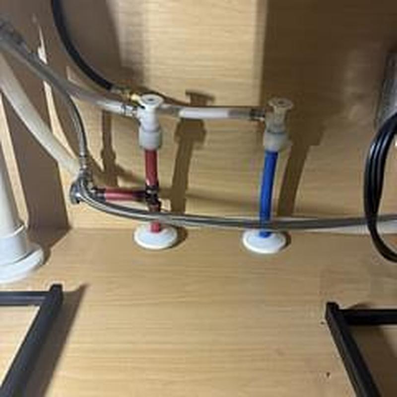 Hot and cold shut off valves under kitchen sink