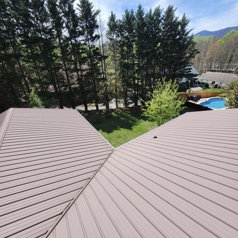 Metal roof panels with replaced bottom row screws