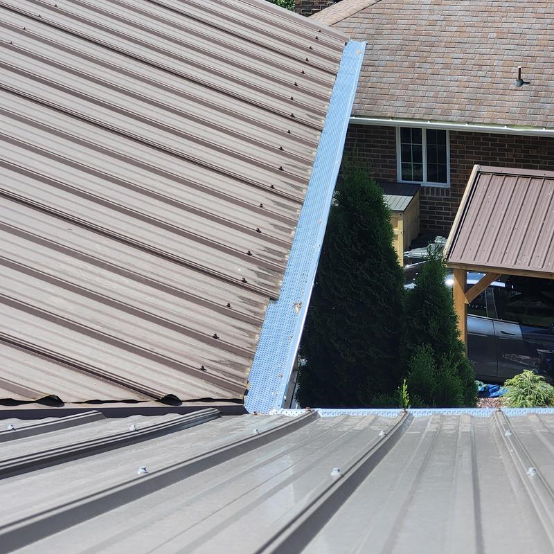 Metal roof panel screws replacement on bottom row