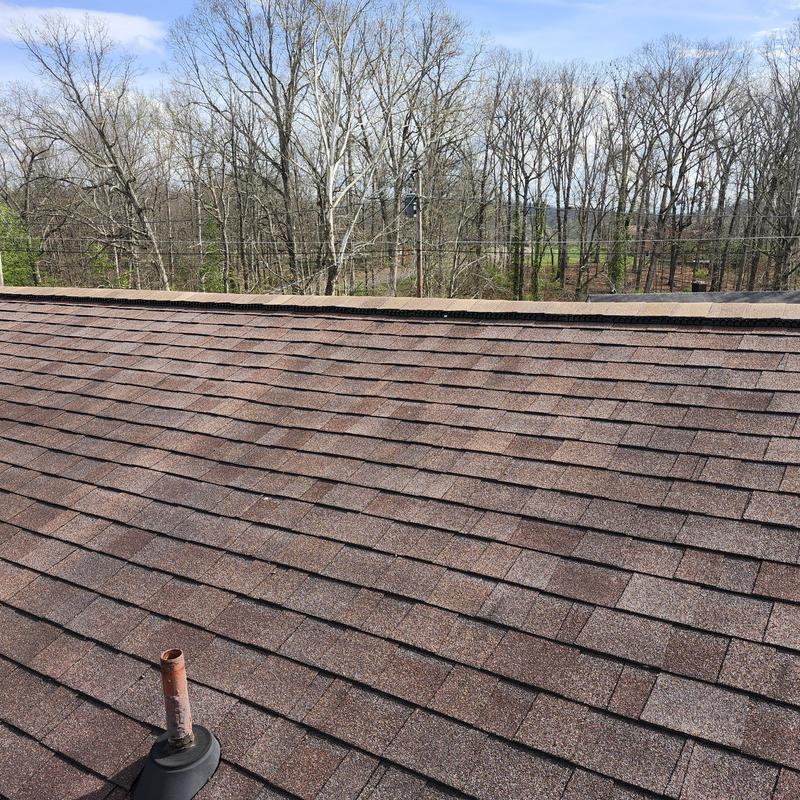 Ridge cap missing on aged asphalt shingle roof