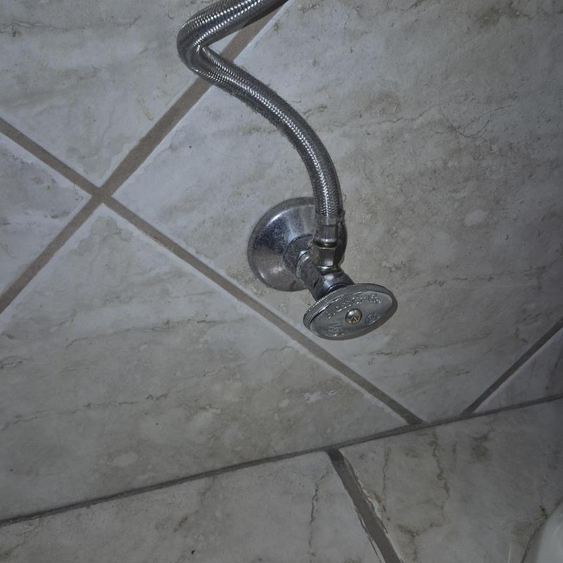 Quarter turn angle stop valve with supply line on tile