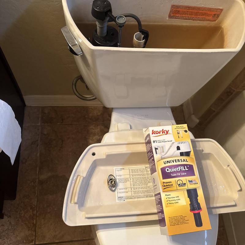 Toilet fill valve with packaging box inside tank