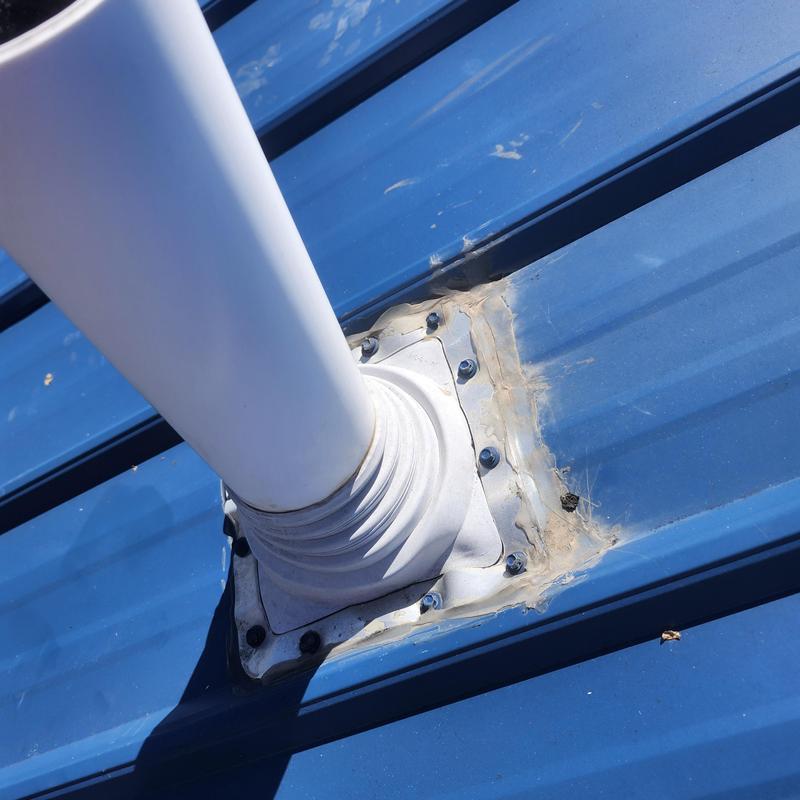 Vent pipe boot on metal roof with sealant and screws