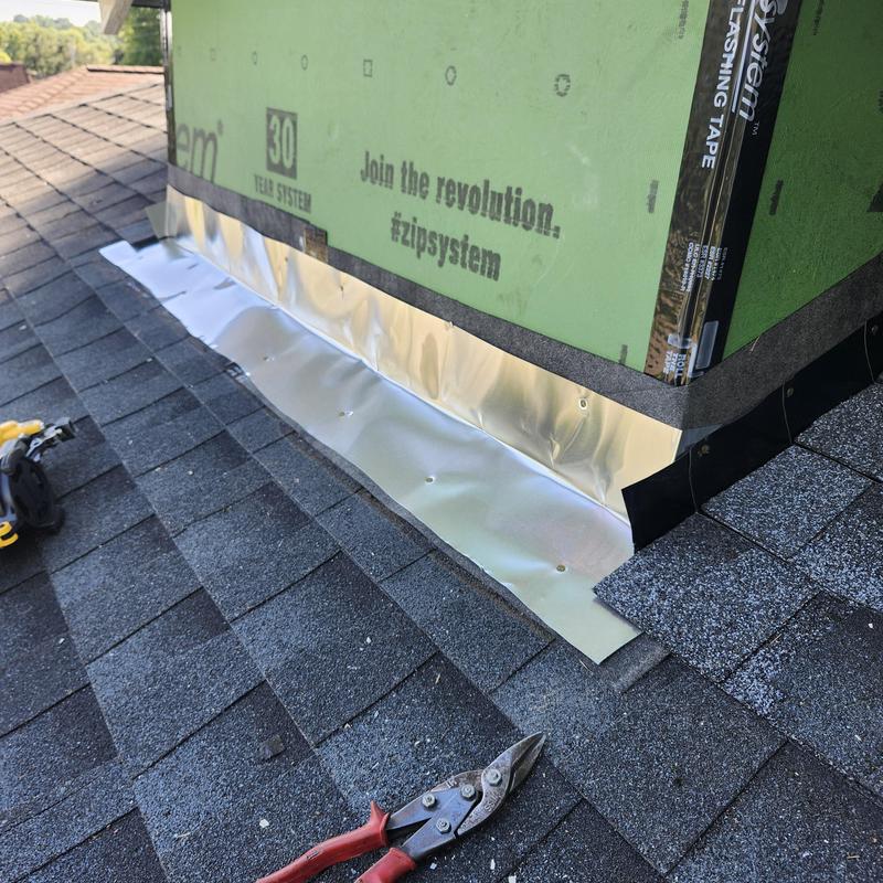 Roof flashing installation on shingle roof near wall