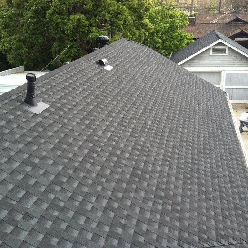 Shingle roof installation with vents on residential house Shingle roof installation with vents on residential house
