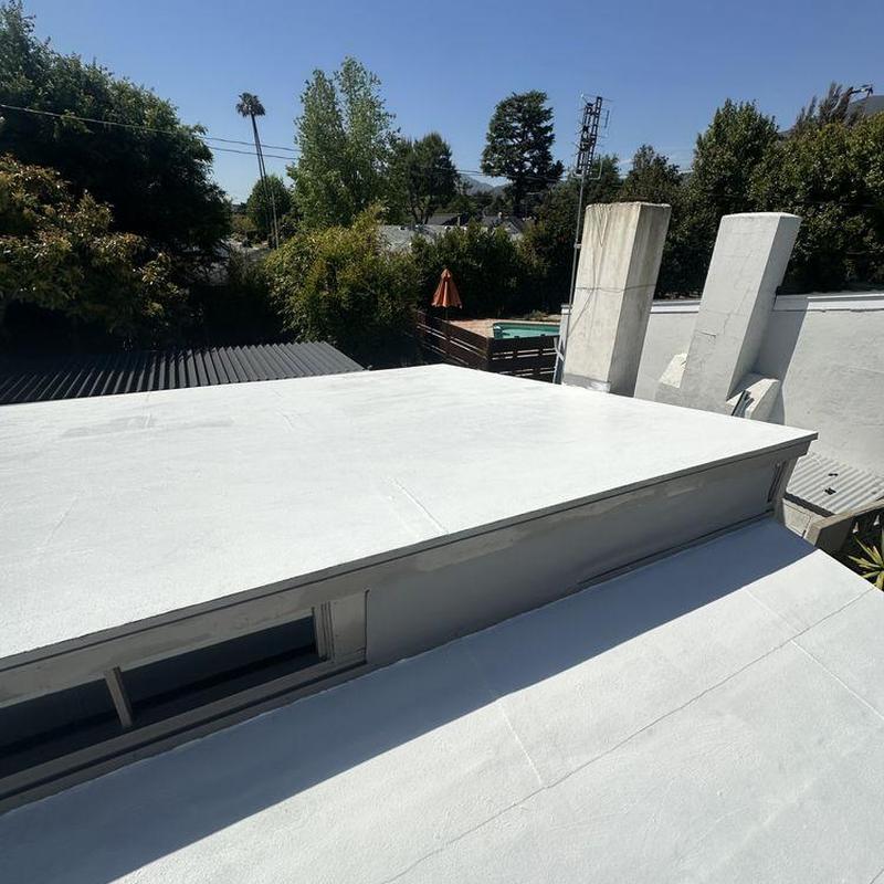 Flat roofing system installation on residential building Flat roofing system installation on residential building